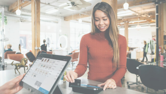 Woman Checking Out at Store